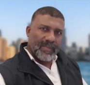 Portrait of Francisco Hurtado, Director of Operations & Official Translation, with a black shirt